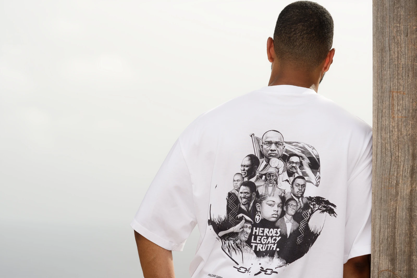 The Fidju Ink shirt worn with its hand-illustrated heroes print visible on the back.